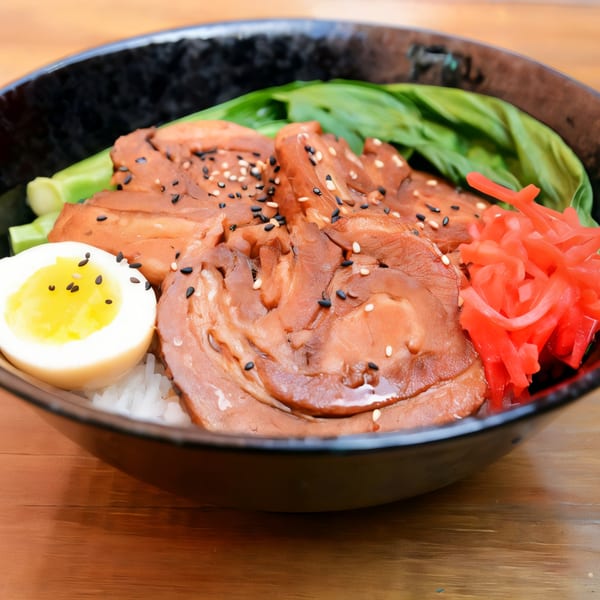 Oki Shōten's Oki Bowl with sliced pork, a boiled egg, pickled ginger, and greens.